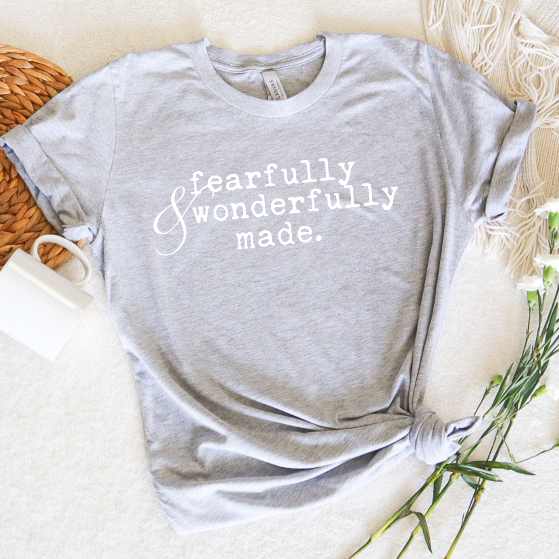 fearfully and wonderfully made printed typewriter style faith base graphic tee shirt.  Christian apparel style on Bella Canvas athletic grey tee with inspirational quote words and scripture