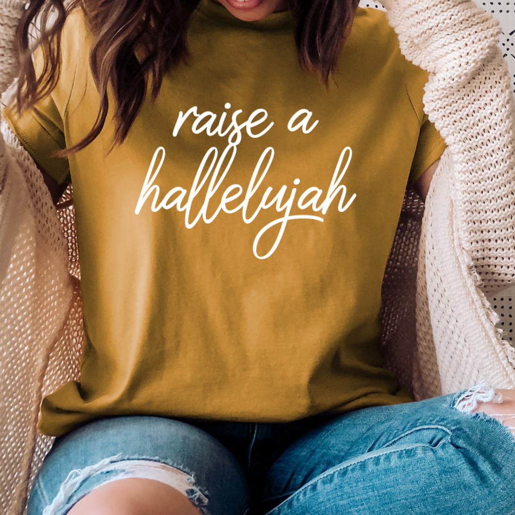 raise a hallelujah graphic scripture design on short sleeve mustard color tee shirt