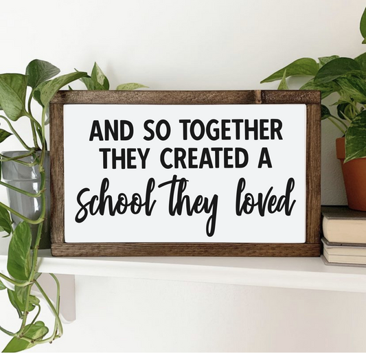 rectangular wooden framed plaque sign decor with the words "and so together they created a school they loved" in a bold print and creative script font