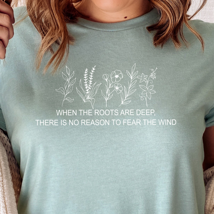 when the roots are deep there is no reason to fear the wind light blue tee shirt